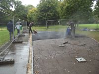 Work starts on the top layer...and so does the rain! Outdoor Gym 2 & 3 016